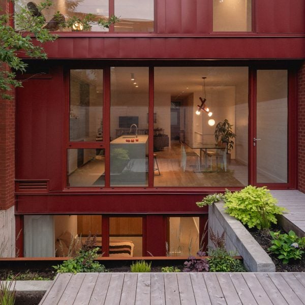 Naturehumaine uses “Merlot” red palette for duplex renovation in Montreal