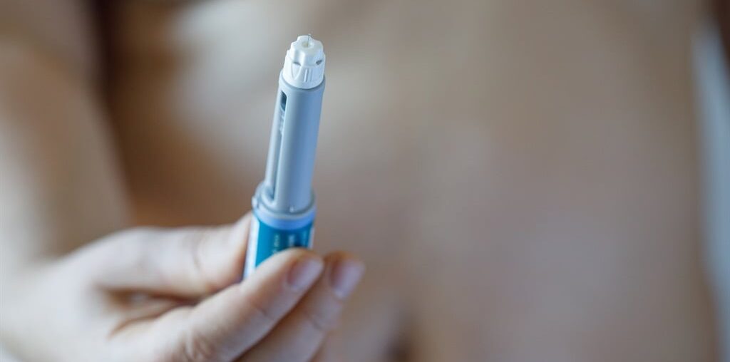 Woman holding semaglutide injection pen or cartridge pen. (J Nemchinova/Getty Images)