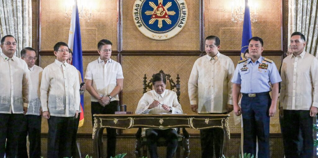 LANDMARK LAWS President Marcos signs into lawthe Philippine Maritime Zones Act and the Philippine Archipelagic Sea Lanes Act in Malacañang on Friday. Present were Senate President Francis Escudero, Speaker Martin Romualdez, AFP Chief of Staff Gen. Romeo Brawner Jr., National Security Adviser Eduardo Año, Senator Francis Tolentino and Philippine Coast Guard Commandant Adm. Ronnie Gavan.