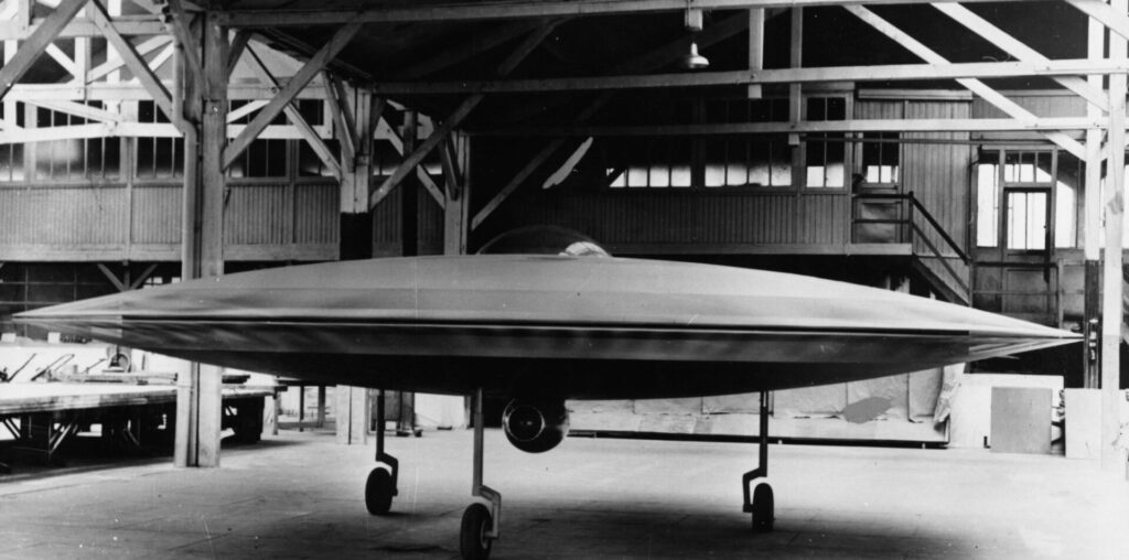 A 3/5 scale model of a proposed VTOL ‘flying saucer’ aircraft, the Couzinet Aerodyne RC-360, on display at a workshop on the Ile de la Jatte in Levallois-Perret, Paris, 1955