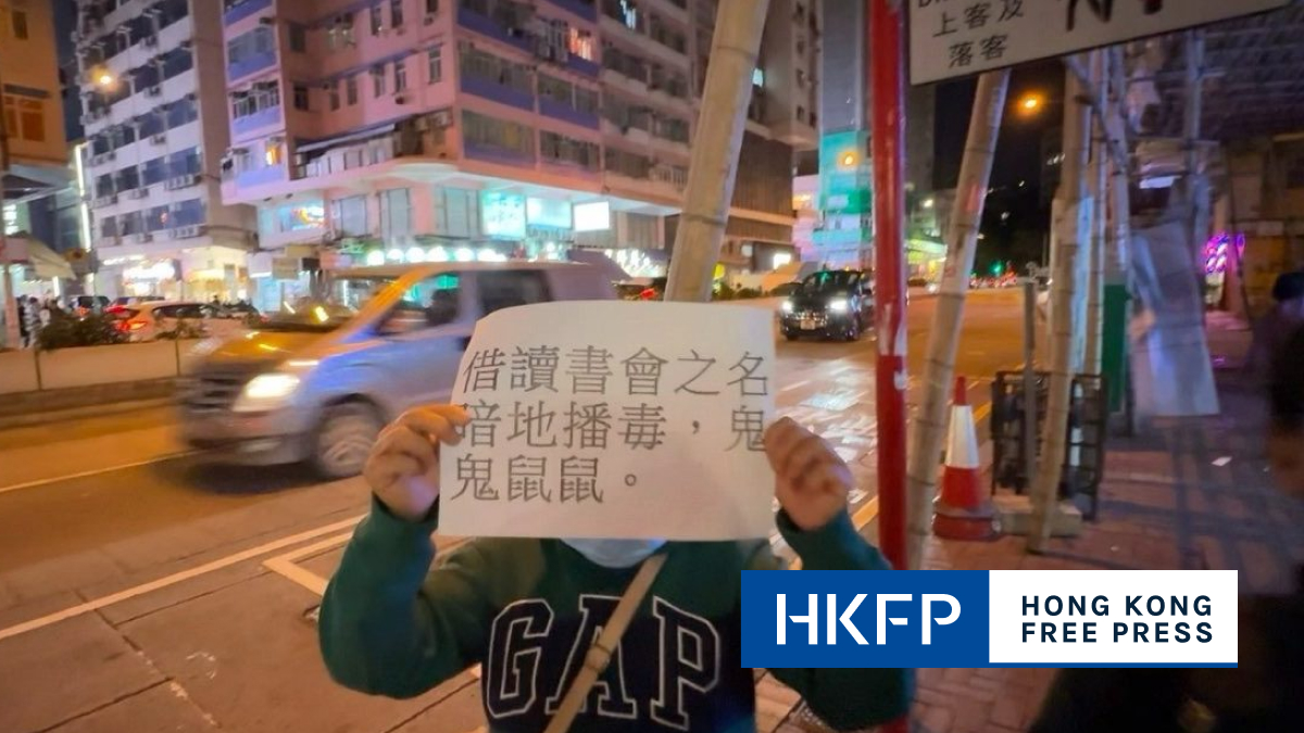 Protesters at HK travel writer’s book launch accuse him of ‘spreading poison’