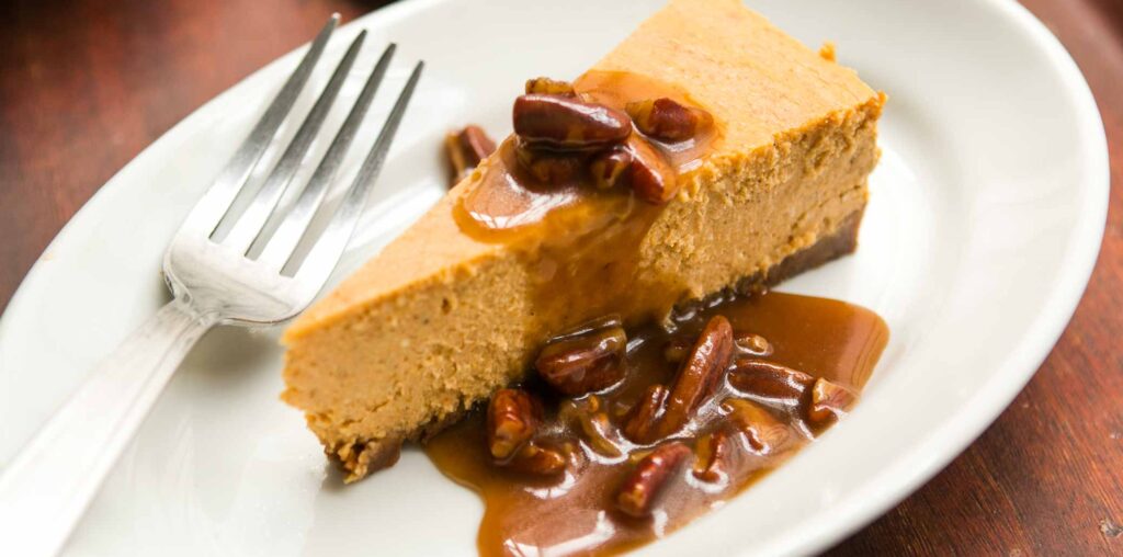 Pumpkin Cheesecake with Pecan Praline Sauce