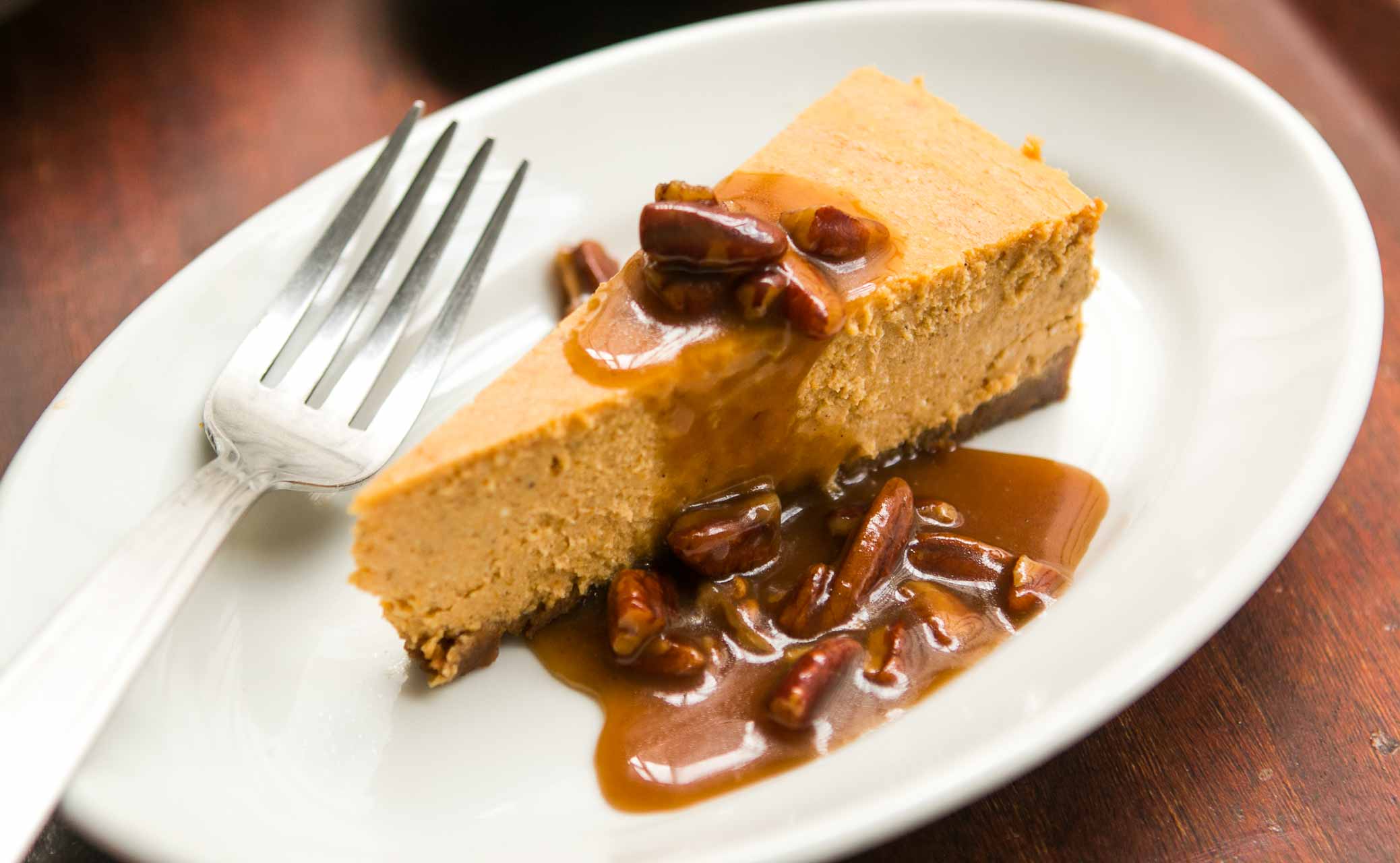 Pumpkin Cheesecake with Pecan Praline Sauce