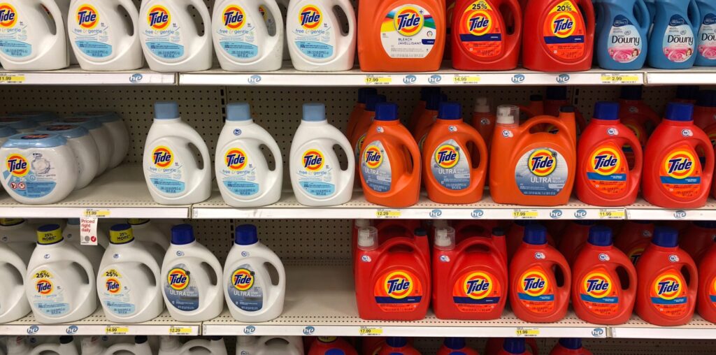 Photograph of laundry detergent on a shelf- indicative of savings.