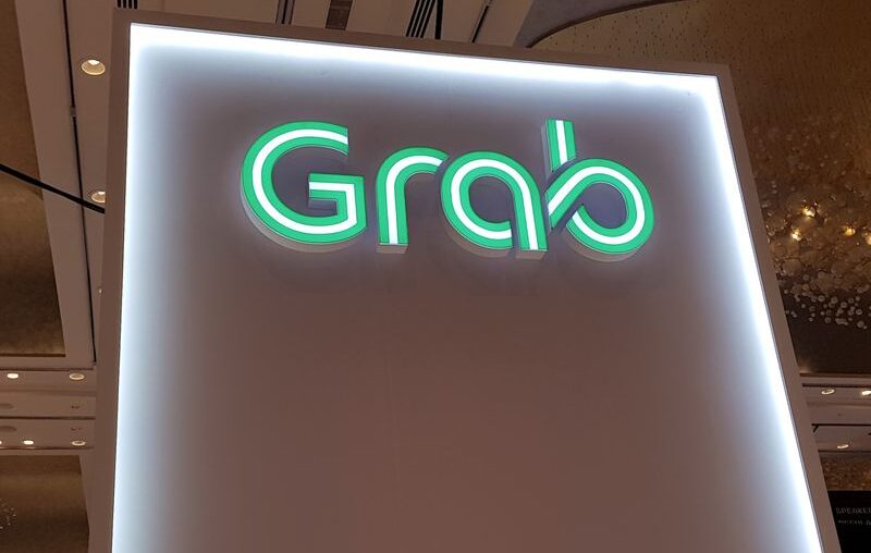 Singapore's Grab raises annual revenue forecast, shares jump