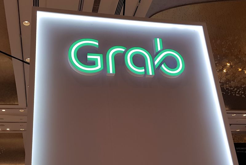 Singapore’s Grab raises annual revenue forecast, shares jump