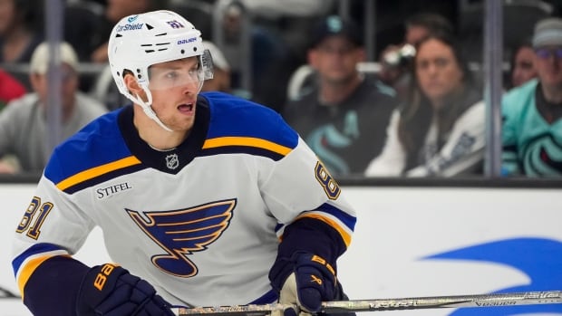 St. Louis Blues forward Dylan Holloway departs on stretcher after he was struck in neck by puck | CBC Sports