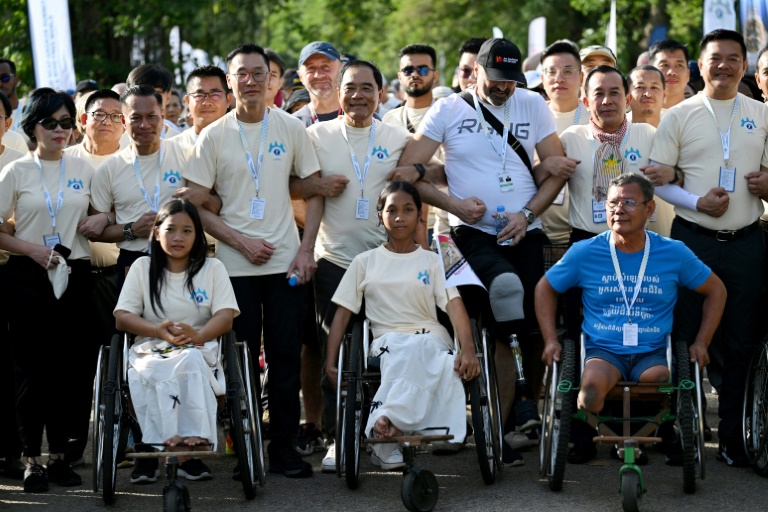 Survivors, sniffing dogs join anti-mine march at Cambodia’s Angkor Wat