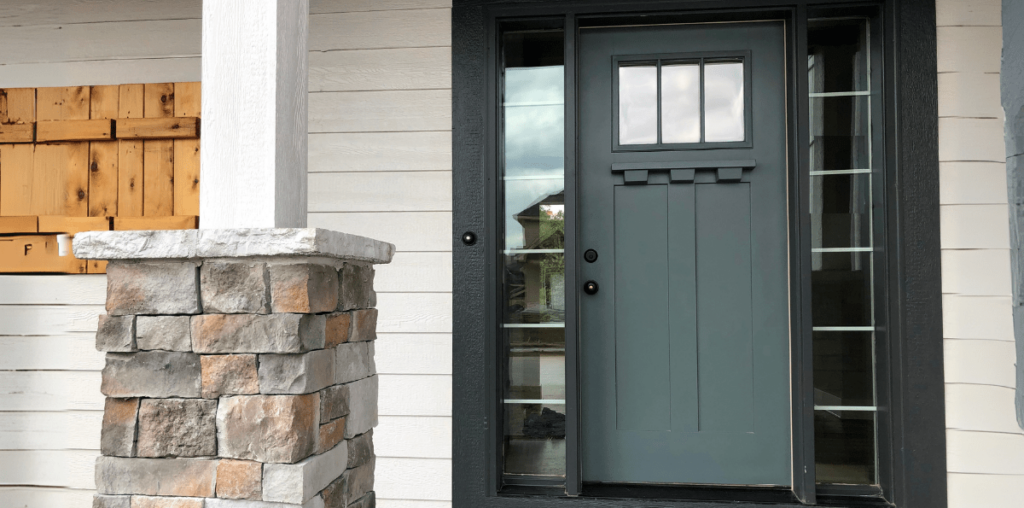 Dark matte green front door.