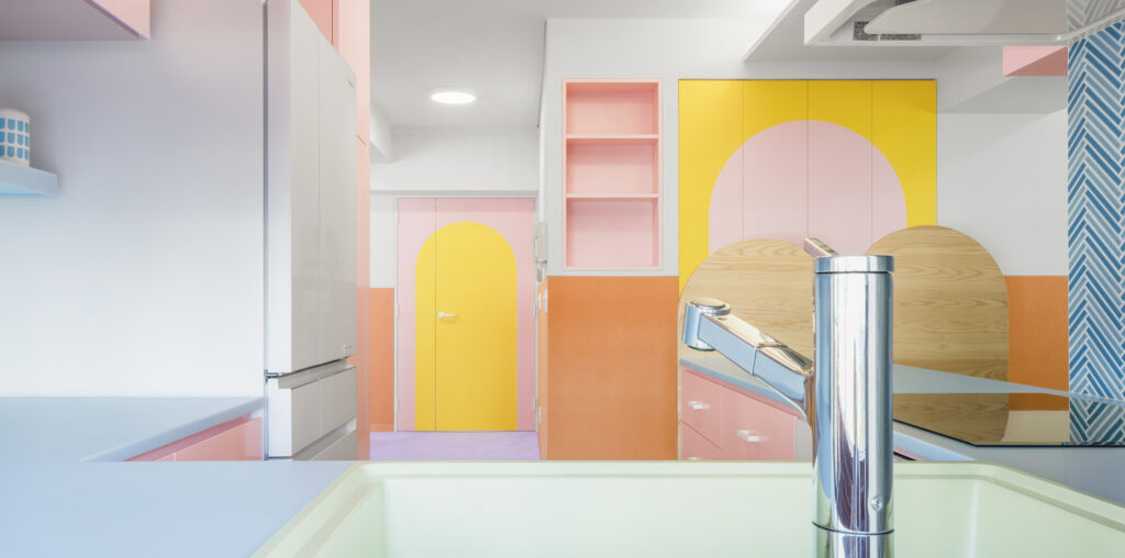 Vibrancy and Utility: Embracing Color in Urban Apartment Kitchens