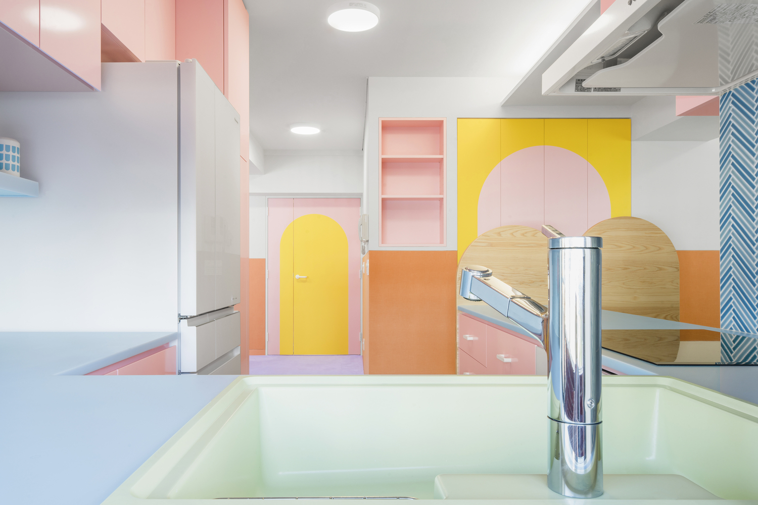 Vibrancy and Utility: Embracing Color in Urban Apartment Kitchens