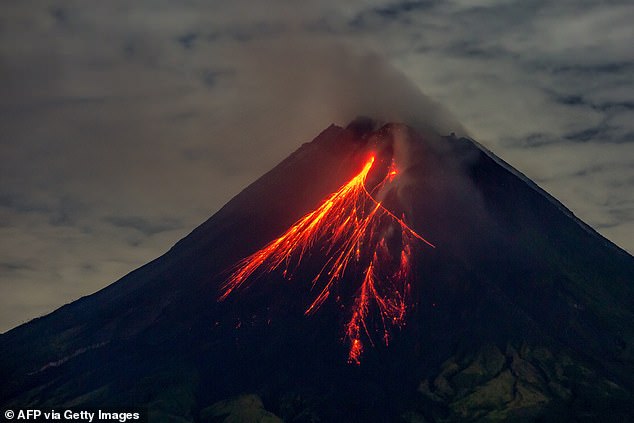 Volcanic eruption kills at least ten as fireballs crash down on villagers in Indonesia