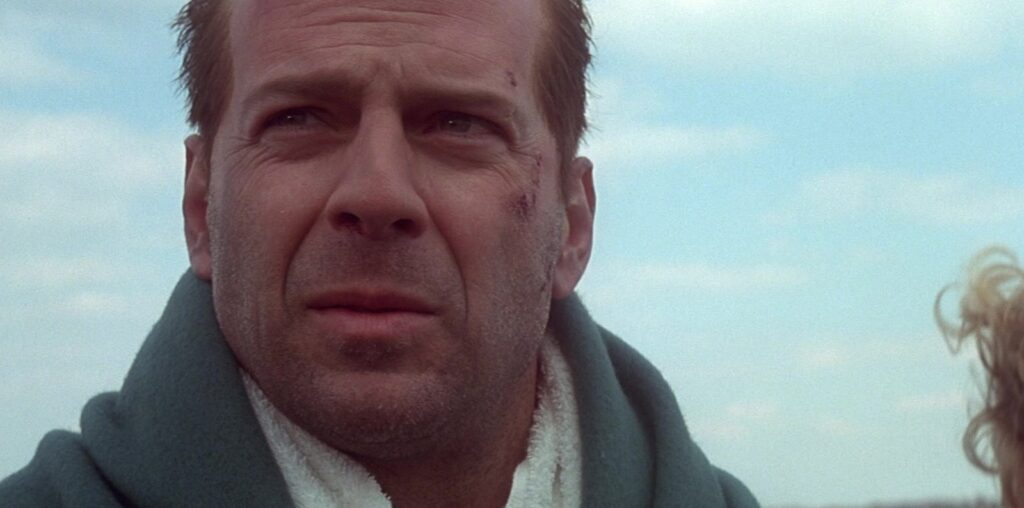 Why Bruce Willis Knew That Die Hard With A Vengeance's Original Ending Would Be Reshot - SlashFilm