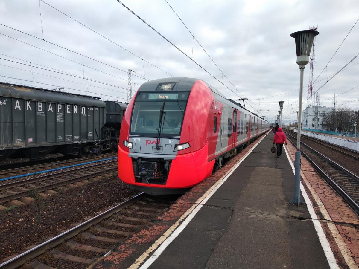 Woman in headphones left unharmed after being run over by passenger train