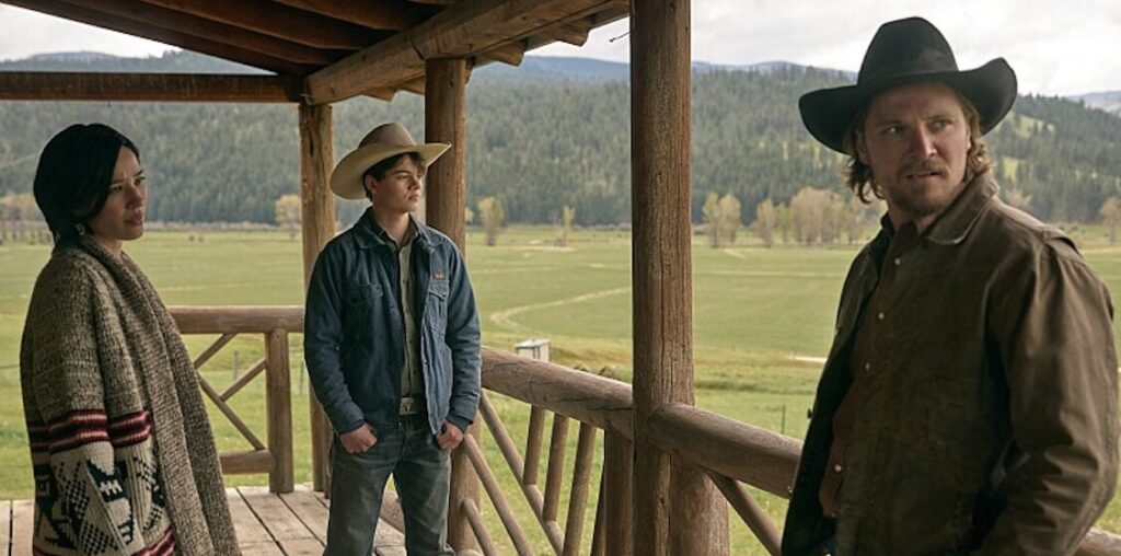 L-R: Kelsey Asbille as Monica Long, Brecken Merrill as Tate Dutton, Luke Grimes as Kacey Dutton on episode 509 of Paramount Network