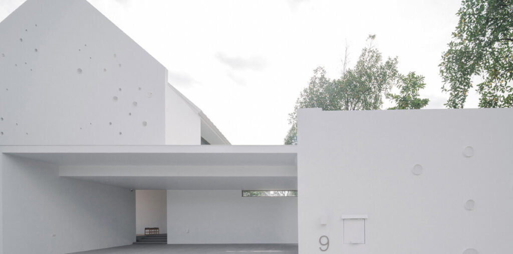 anonym studio's all-white house in bangkok adopts scandinavian minimalism