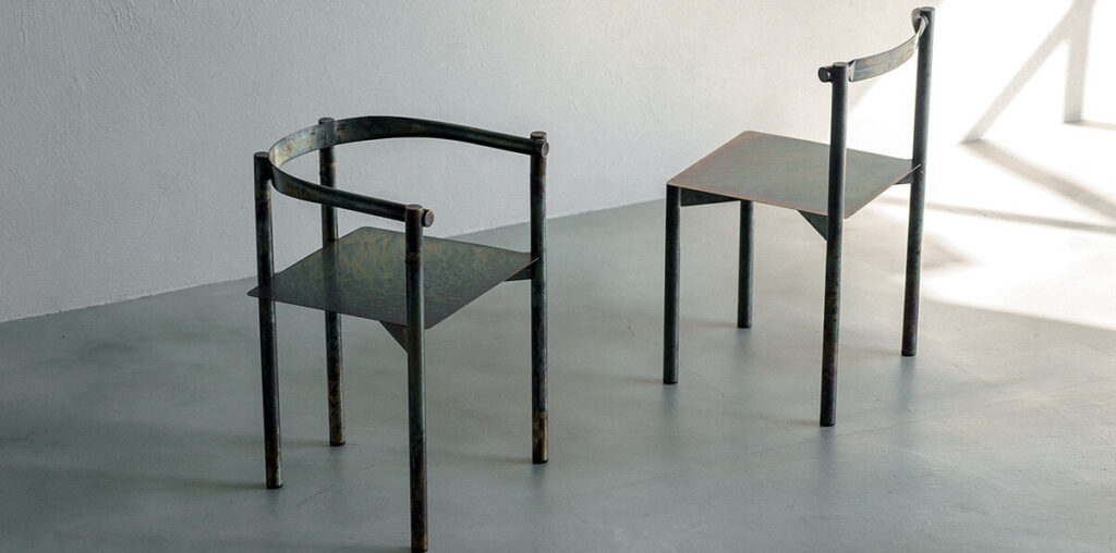 flattened piping becomes linear backrest in masaya kawamoto’s oxidized steel chair