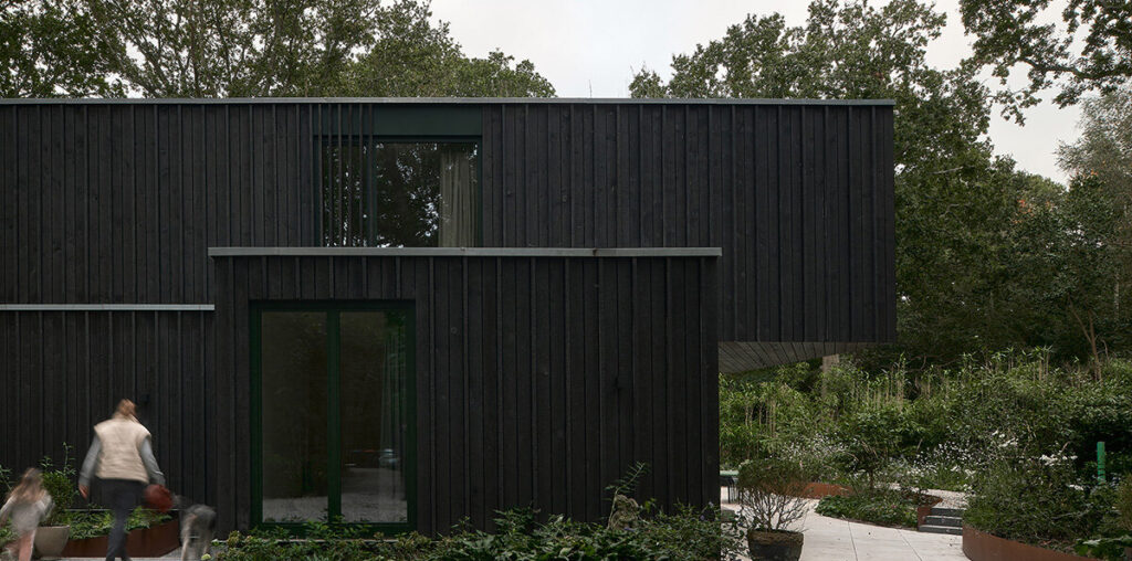 floating timber volume crowns forest house by kumiki architecture in the netherlands