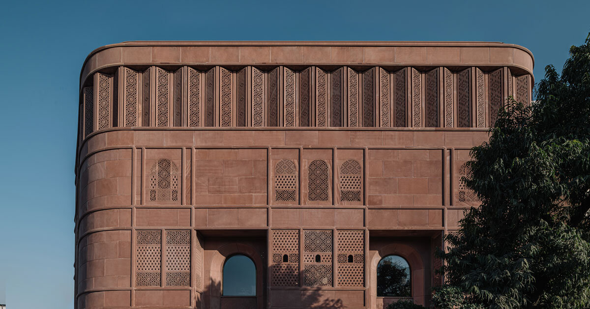 hand-carved red sandstone clads jewelry store’s facade by studio lotus in jaipur