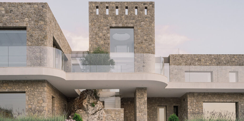 wrapped in stone, corfu house by georgios apostolopoulos overlooks the sea in greece