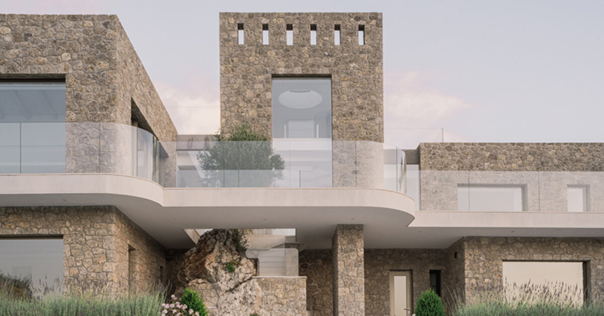 wrapped in stone, corfu house by georgios apostolopoulos overlooks the sea in greece