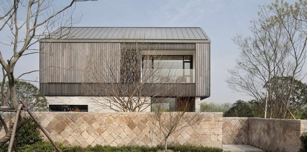 yakisugi wood and stone scraps wrap levels of urbanfabric design's cabin in china wetlands