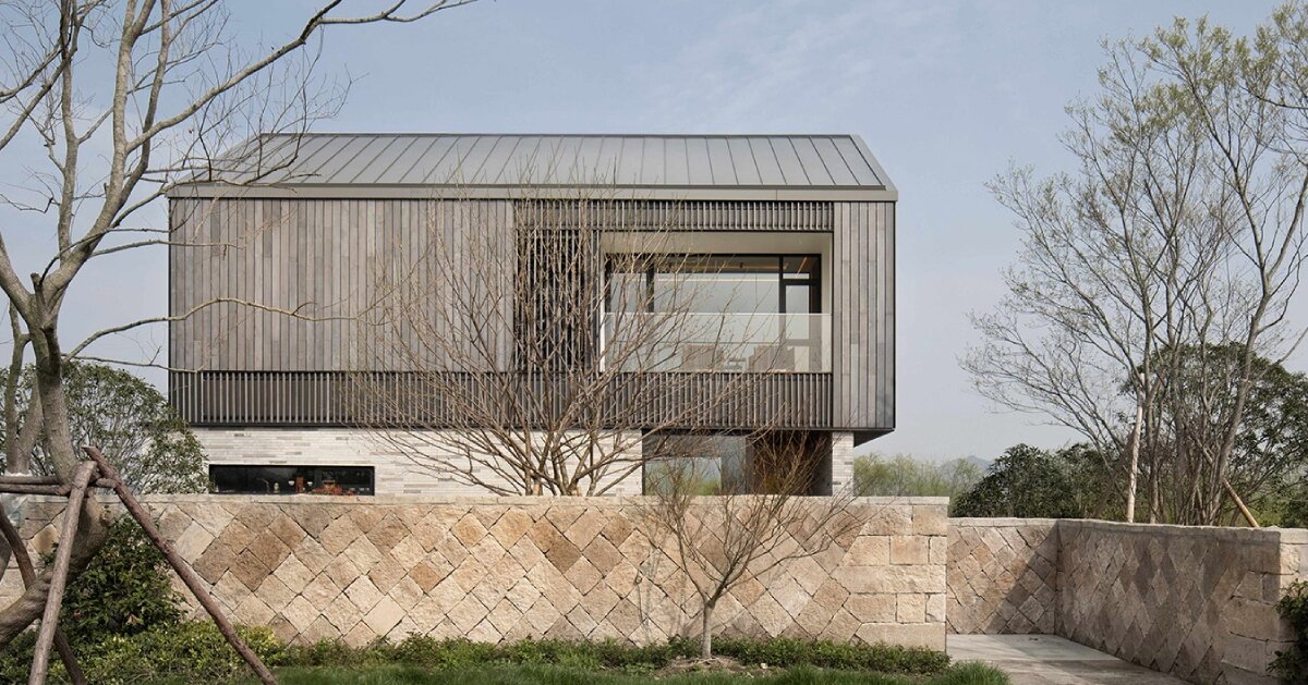 yakisugi wood and stone scraps wrap levels of urbanfabric design’s cabin in china wetlands