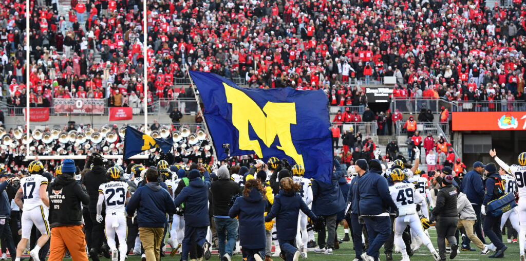 Flag-planting celebrations cause fights to break out in several heated college football rivalry games